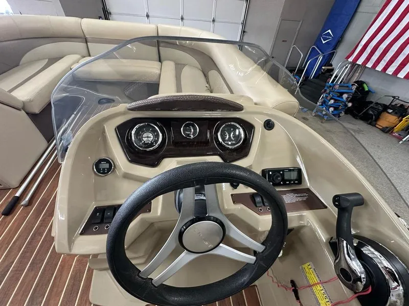 Slide: The Image of Steering console of 2018 Crest Classic 230 SLC boat with gauges and controls. - 9