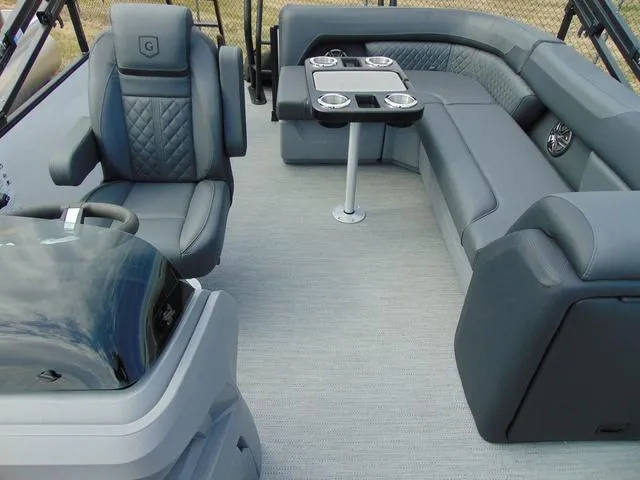 Slide: The Image of 2025 Godfrey Pontoons Sweetwater 2086 C interior with luxurious seating and table. - 6
