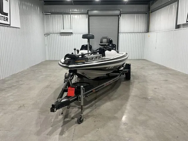 Slide: The Image of 2004 Skeeter SX190 boat on trailer in a storage facility. - 2