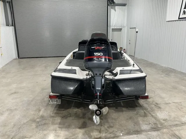 Slide: The Image of 2004 Skeeter SX190 boat with Yamaha 150 engine in a garage. - 3