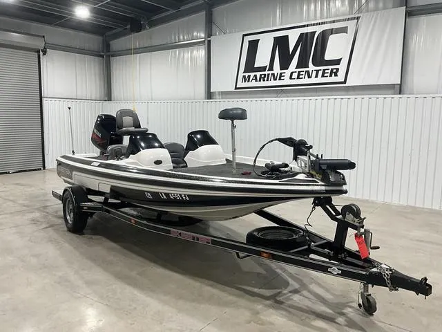 Slide: The Image of 2004 Skeeter SX190 boat on trailer at LMC Marine Center showroom. - 6