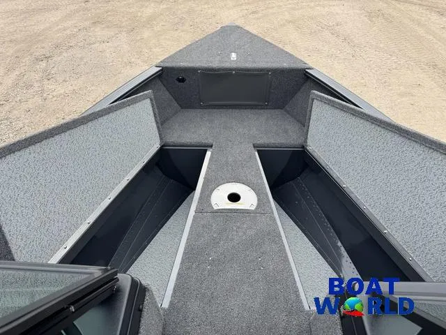 Slide: The Image of 2021 Lund 1675 Adventure Sport boat interior with open storage compartments. - 13