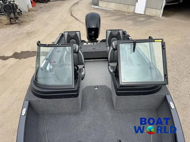 Slide: The Image of 2021 Lund 1675 Adventure Sport boat with open windshield, parked on gravel. - 18