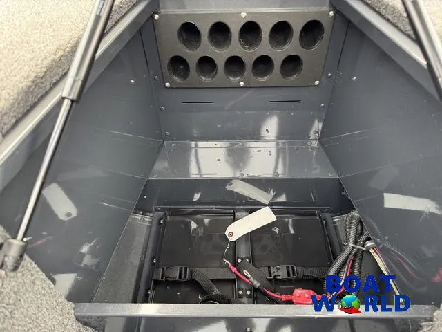 Slide: The Image of 2021 Lund 1675 Adventure Sport boat interior compartment with wiring and storage space. - 20