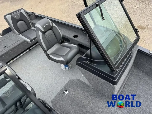 Slide: The Image of 2021 Lund 1675 Adventure Sport boat interior with seating and windshield, branded "Boat World." - 23