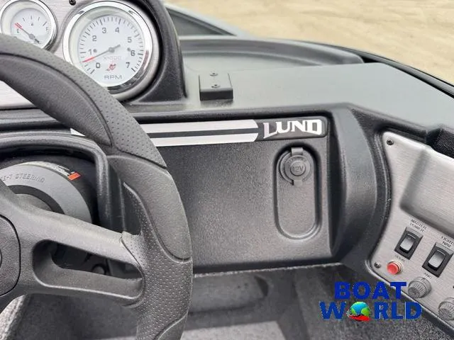 Slide: The Image of 2021 Lund 1675 Adventure Sport dashboard with steering wheel and gauges. - 30