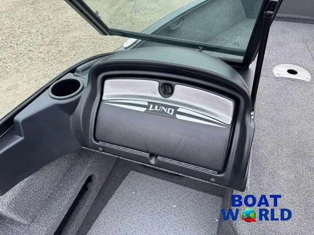 Slide: The Image of 2021 Lund 1675 Adventure Sport boat interior with storage compartment and cup holder. - 36
