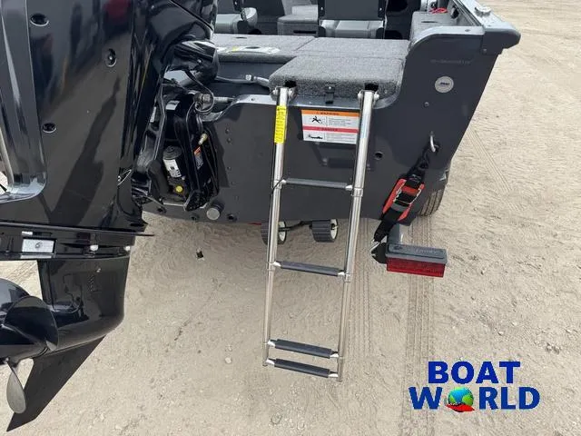 Slide: The Image of 2021 Lund 1675 Adventure Sport boat with ladder and motor, displayed on sandy ground. - 39