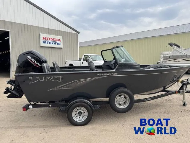 Slide: The Image of 2021 Lund 1675 Adventure Sport boat on trailer, parked outside Honda Marine building. - 47