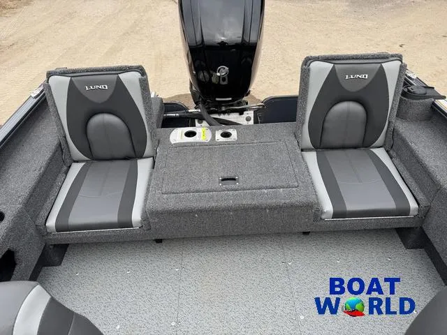 Slide: The Image of 2021 Lund 1675 Adventure Sport boat interior with two gray seats and motor. - 6