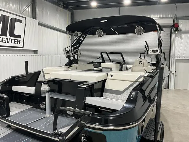 Slide: The Image of 2022 Heyday H22 boat in showroom, featuring sleek design and modern seating. - 13