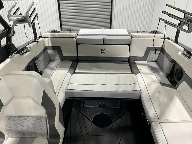 Slide: The Image of 2022 Heyday H22 boat interior with gray and white seating, modern design, and ample storage. - 8