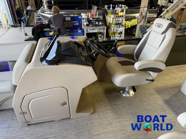 Slide: The Image of 2025 Bentley Pontoons Legacy 220 Swingback interior with captain's chair and control console. - 11