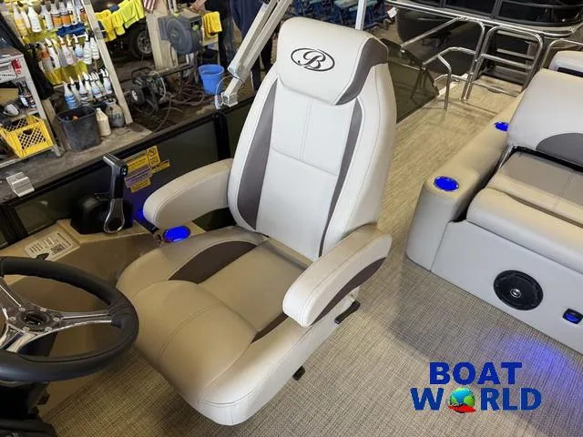 Slide: The Image of 2025 Bentley Pontoons Legacy 220 Swingback interior with luxury seating and steering wheel. - 12