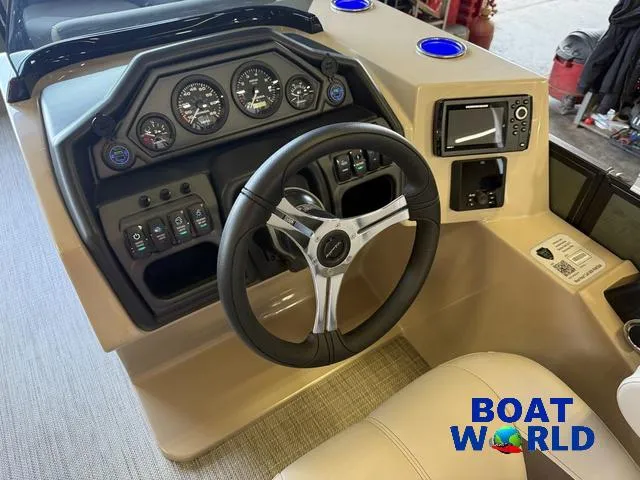 Slide: The Image of 2025 Bentley Pontoons Legacy 220 Swingback dashboard with steering wheel and controls. - 13