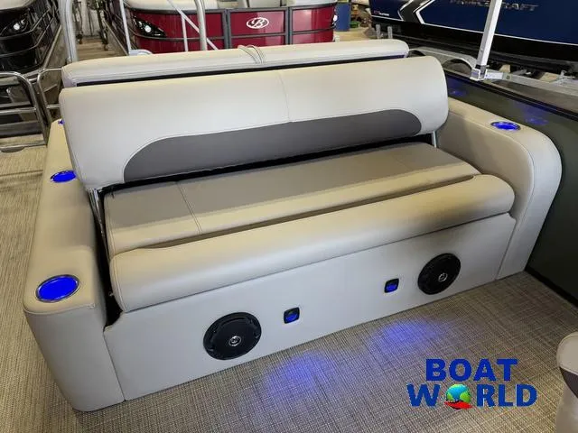 Slide: The Image of 2025 Bentley Pontoons Legacy 220 Swingback interior with modern seating and blue LED cup holders. - 17