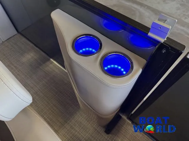 Slide: The Image of 2025 Bentley Pontoons Legacy 220 Swingback cup holders with blue LED lighting. - 25