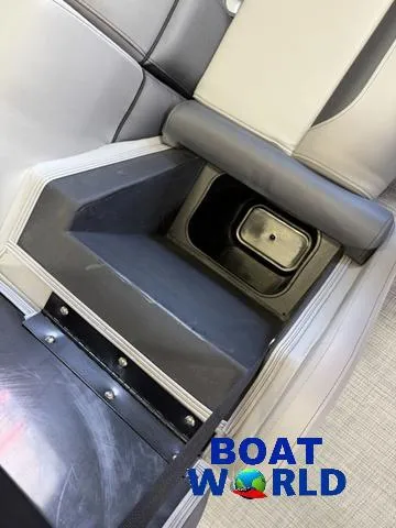 Slide: The Image of 2025 Bentley Pontoons Legacy 220 Swingback interior seating with storage compartment, Boat World logo. - 34