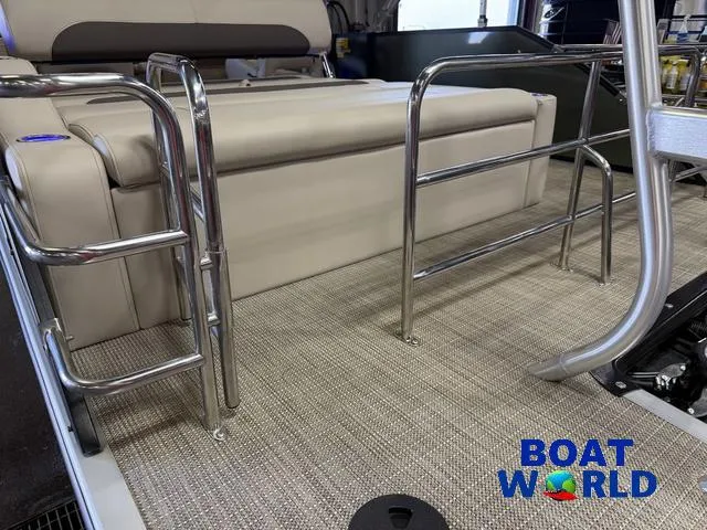 Slide: The Image of 2025 Bentley Pontoons Legacy 220 Swingback interior with beige seating and metal railings. - 40