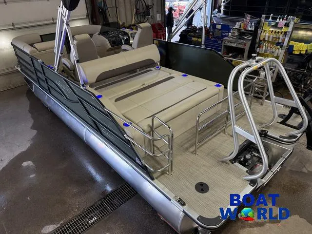 Slide: The Image of 2025 Bentley Pontoons Legacy 220 Swingback with Honda 4-Stroke EFI in a showroom. - 48