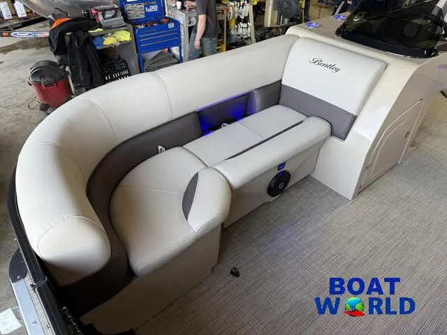 Slide: The Image of 2025 Bentley Pontoons Legacy 220 Swingback interior with Honda 4-Stroke EFI engine, showcased at Boat World. - 8
