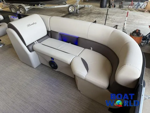 Slide: The Image of 2025 Bentley Pontoons Legacy 220 Swingback interior with plush seating and modern design. - 9