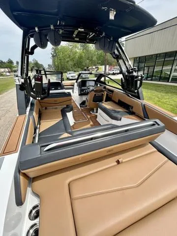 Slide: The Image of 2023 Cobalt R6 Surf boat interior with luxurious seating and modern design. - 12