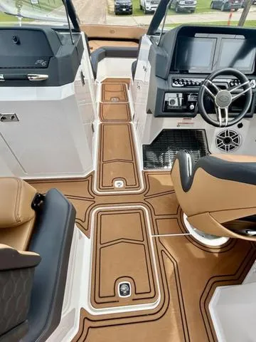 Slide: The Image of 2023 Cobalt R6 Surf boat interior with modern dashboard and luxurious seating. - 29