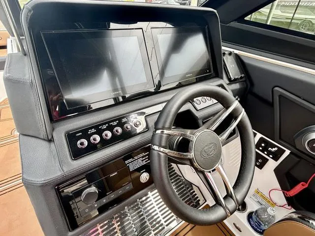 Slide: The Image of 2023 Cobalt R6 Surf dashboard with dual screens and modern steering wheel. - 33