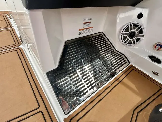 Slide: The Image of 2023 Cobalt R6 Surf boat interior with speaker and non-slip flooring. - 34