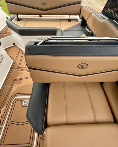 Slide: The Image of 2023 Cobalt R6 Surf boat interior with tan and black seating. - 38