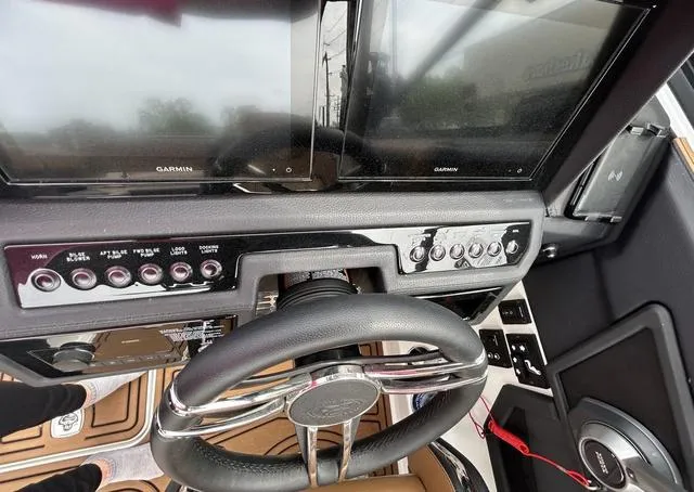 Slide: The Image of 2023 Cobalt R6 Surf boat dashboard with Garmin displays and control panel. - 44