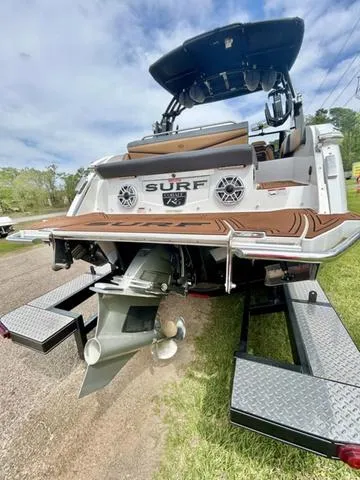 Slide: The Image of 2023 Cobalt R6 Surf boat on trailer, showcasing rear design and propeller. - 8