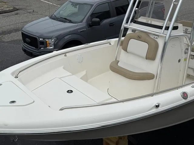 Slide: The Image of 2016 Key West 189FS boat with seating, parked beside a gray truck. - 10