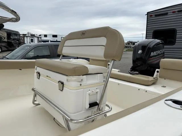 Slide: The Image of 2016 Key West 189FS boat with cushioned seating and Mercury outboard motor. - 11