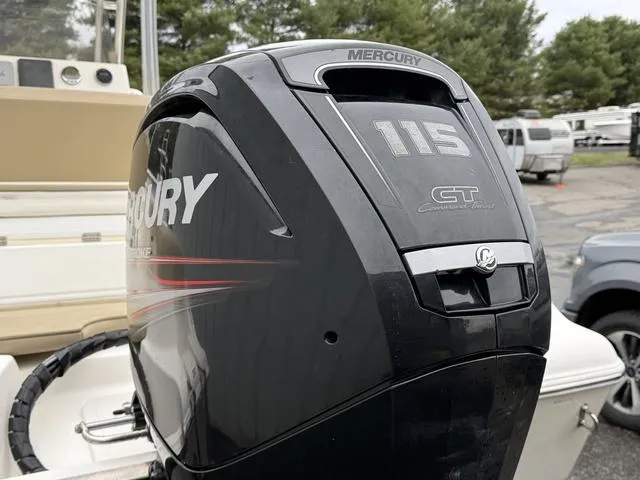 Slide: The Image of Mercury 115 outboard motor on 2016 Key West 189FS boat, parked outdoors. - 13