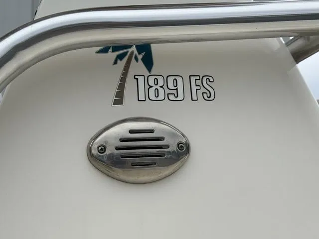 Slide: The Image of 2016 Key West 189FS boat detail with palm tree logo and vent. - 16