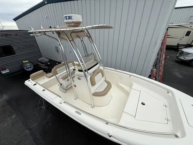 Slide: The Image of 2016 Key West 189FS boat with T-top, parked near RVs and trailers. - 5