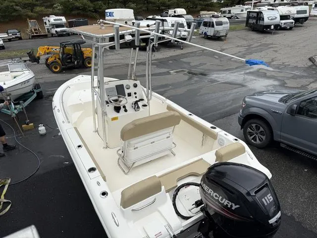 Slide: The Image of 2016 Key West 189FS boat with Mercury 115 engine in a parking lot. - 7
