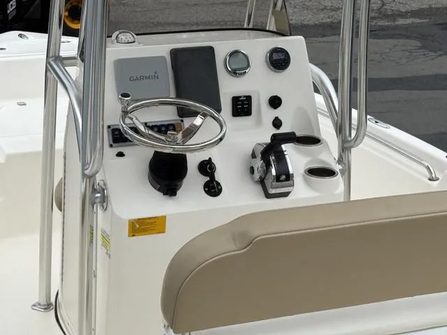 Slide: The Image of 2016 Key West 189FS boat console with Garmin navigation and steering wheel. - 8
