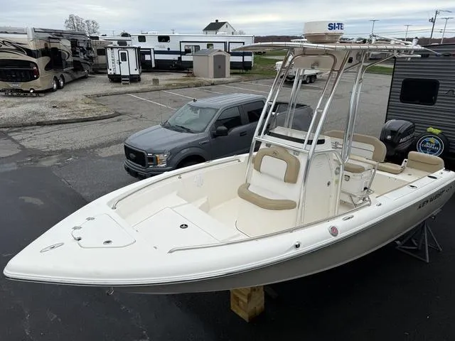 Slide: The Image of 2016 Key West 189FS boat in parking lot, surrounded by vehicles and trailers. - 9