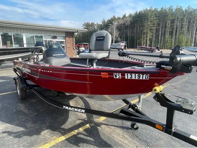 Slide: The Image of 2019 Tracker Super Guide™ V-16 SC fishing boat on trailer, parked outdoors. - 3