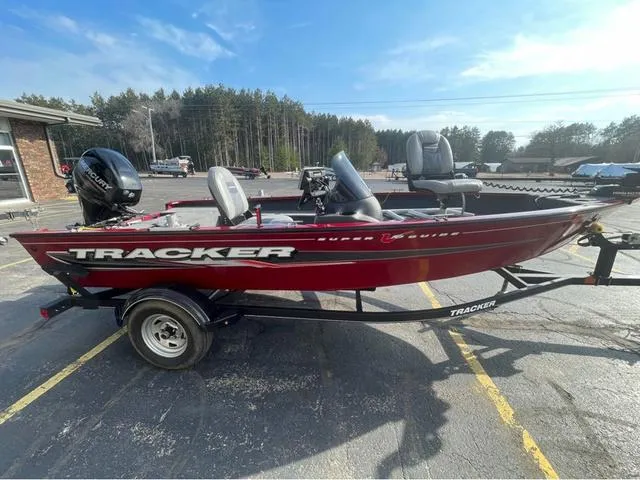 Slide: The Image of 2019 Tracker Super Guide V-16 SC boat on trailer, parked outdoors. - 4
