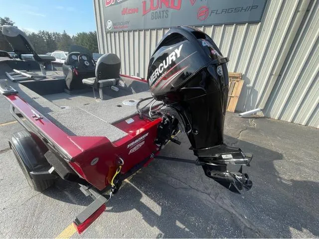 Slide: The Image of 2019 Tracker Super Guide V-16 SC boat with Mercury outboard motor, parked outdoors. - 6