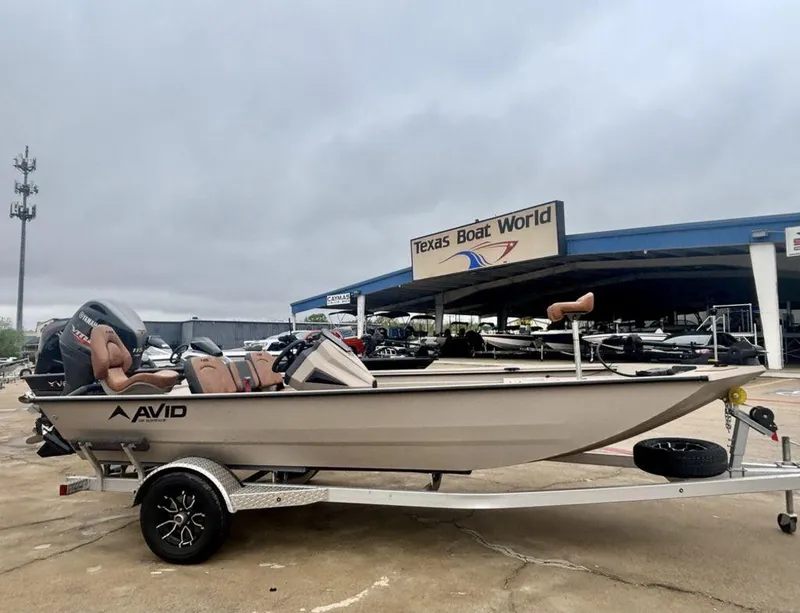 Slide: The Image of 2025 Avid 18 Rogue SC boat on trailer at Texas Boat World dealership. - 0