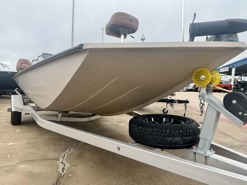 Slide: The Image of 2025 Avid 18 Rogue SC boat on trailer, showcasing hull design and trailer features. - 1