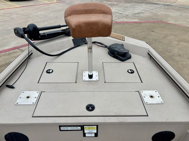 Slide: The Image of 2025 Avid 18 Rogue SC boat deck with brown seat and storage compartments. - 6