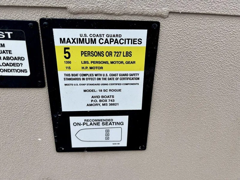 Slide: The Image of U.S. Coast Guard capacity label for Avid 18 Rogue SC, 2025 model, 5 persons or 727 lbs. - 7