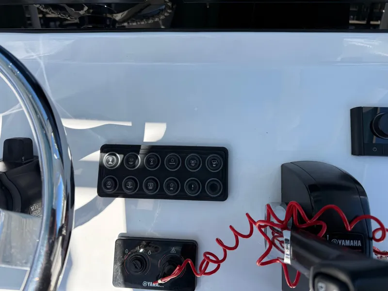 Slide: The Image of 2024 Sportsman Heritage 231 Center Console dashboard with controls and steering wheel. - 13