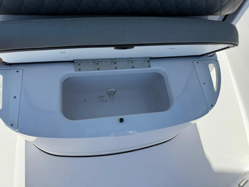 Slide: The Image of 2024 Sportsman Heritage 231 Center Console storage compartment with cushioned seat. - 17